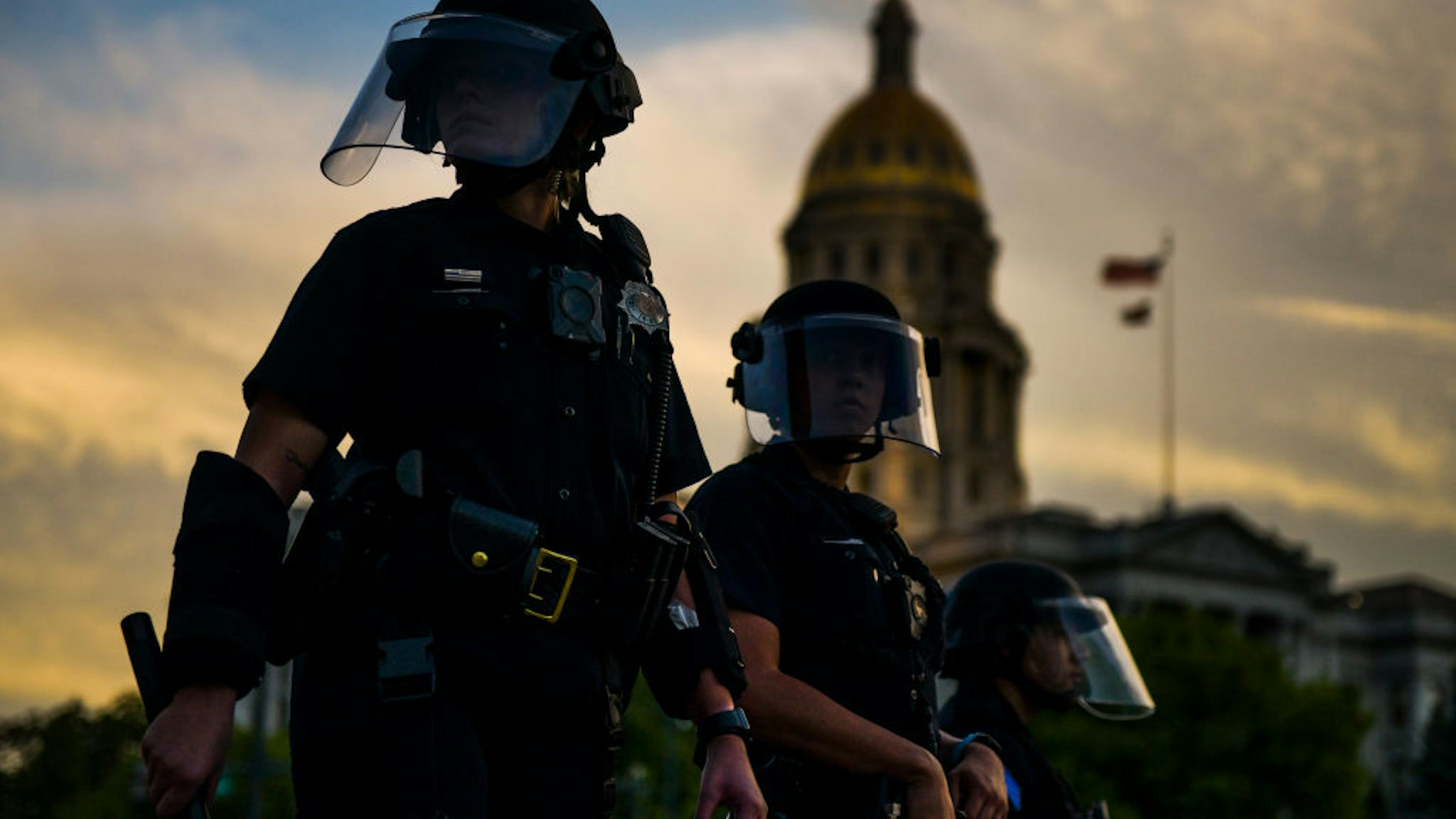 DENVER, CO - MAY 29: Police officers watch over a crowd of people near the Colorado state capitol during a protest on May 29, 2020 in Denver, Colorado. This was the second day of protests in Denver, with more demonstrations planned for the weekend. Demonstrations are being held across the US after George Floyd died in police custody on May 25th in Minneapolis, Minnesota.(Photo by Michael Ciaglo/Getty Images)