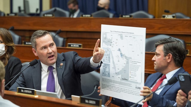 Rep. Michael Waltz (R-FL) questions the panel while Rep. Mike Johnson (R-LA) holds a map of the Middle East during a House Armed Services Committee hearing on Ending the U.S. Military Mission in Afghanistan in the Rayburn House Office Building at the U.S. Capitol on September 29, 2021 in Washington, DC.