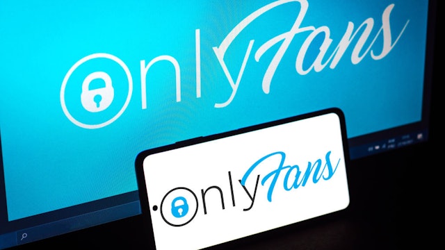BRAZIL - 2021/10/27: In this photo illustration, the OnlyFans logo seen displayed on a smartphone and in the background. (Photo Illustration by Rafael Henrique/SOPA Images/LightRocket via Getty Images)