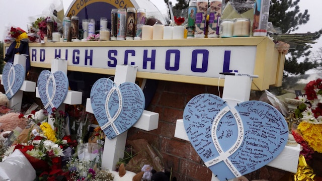 OXFORD, MICHIGAN - DECEMBER 03: A memorial outside of Oxford High School continues to grow on December 03 2021 in Oxford, Michigan.