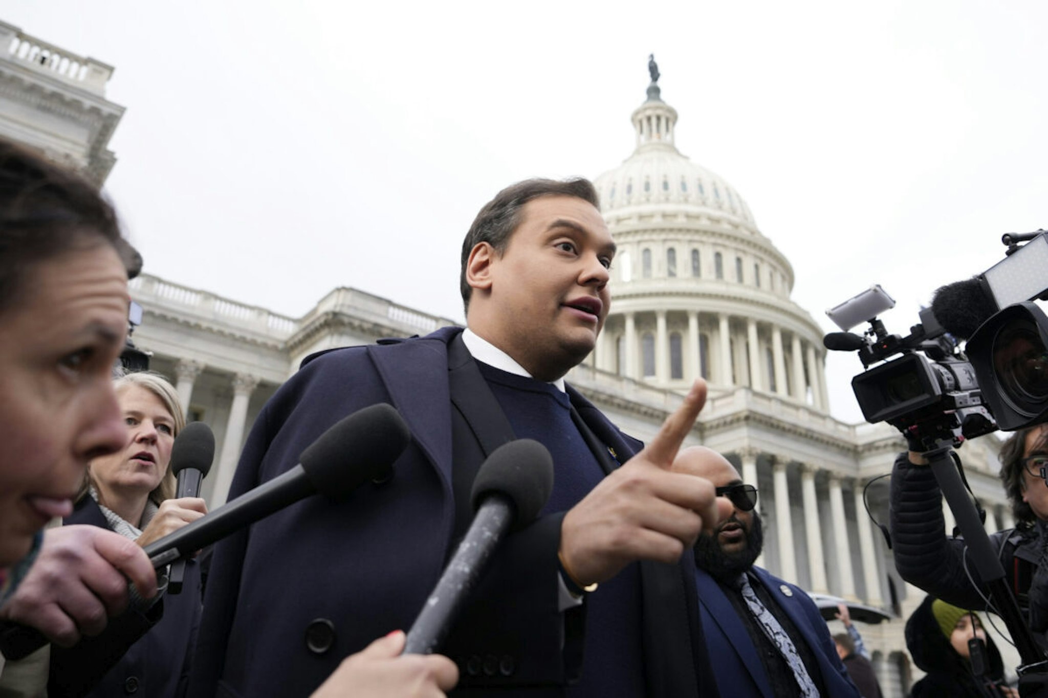 WASHINGTON, DC - DECEMBER 01: Rep. George Santos (R-NY) is surrounded by journalists as he leaves the U.S. Capitol after his fellow members of Congress voted to expel him from the House of Representatives on December 01, 2023 in Washington, DC. Charged by the U.S. Department of Justice with 23 felonies in New York including fraud and campaign finance violations, Santos, 35, was expelled from the House of Representatives by a vote of 311-114. Santos is only the sixth person in U.S. history to be expelled from the House of Representatives.