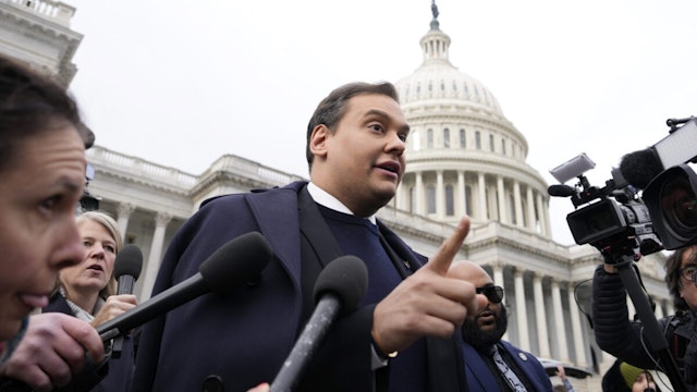 WASHINGTON, DC - DECEMBER 01: Rep. George Santos (R-NY) is surrounded by journalists as he leaves the U.S. Capitol after his fellow members of Congress voted to expel him from the House of Representatives on December 01, 2023 in Washington, DC. Charged by the U.S. Department of Justice with 23 felonies in New York including fraud and campaign finance violations, Santos, 35, was expelled from the House of Representatives by a vote of 311-114. Santos is only the sixth person in U.S. history to be expelled from the House of Representatives.
