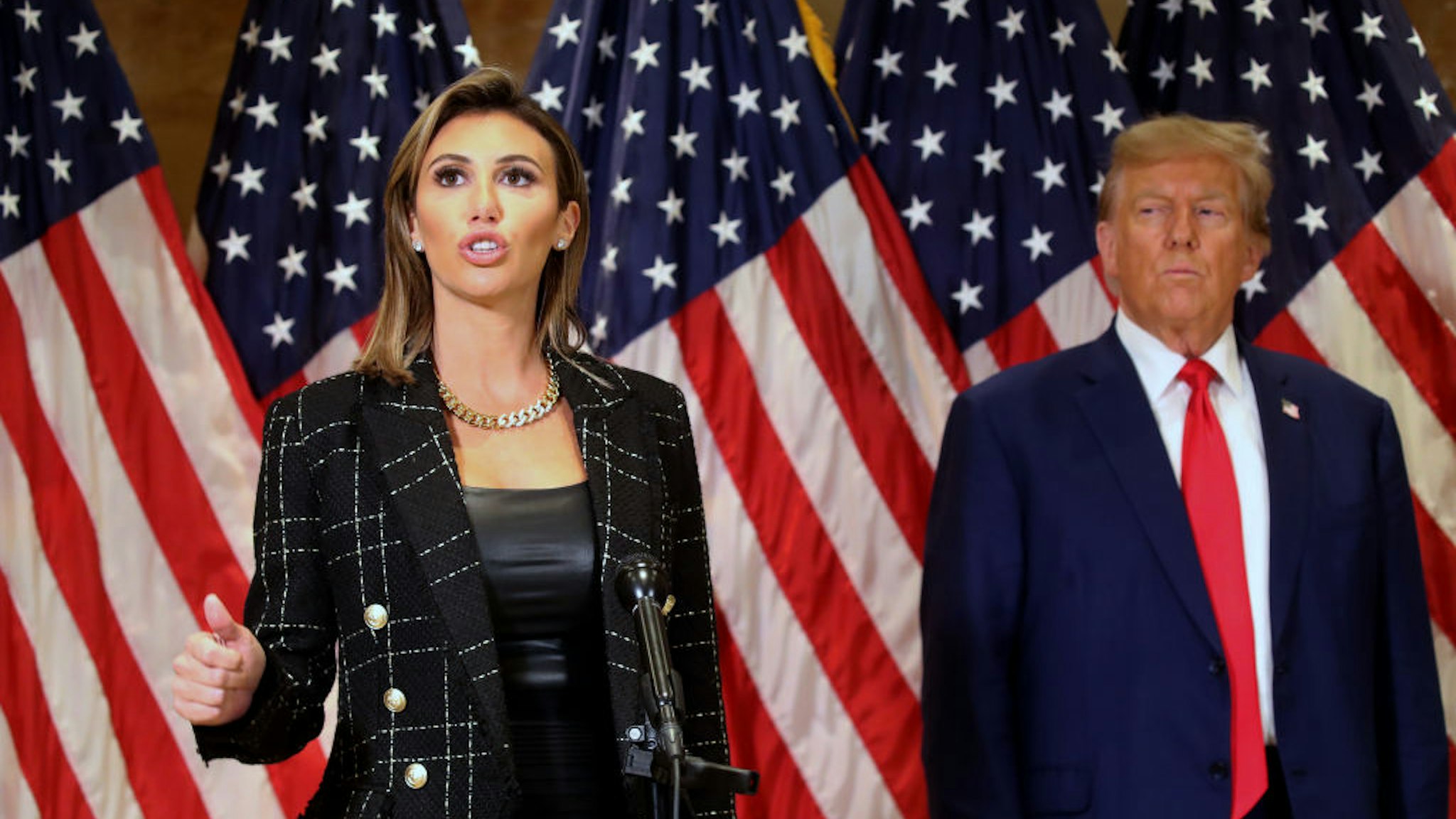 Former U.S. President Donald Trump stands with his lawyer Alina Habba as she speaks to the media at one of his properties, 40 Wall Street, following closing arguments at his civil fraud trial on January 11, 2024 in New York City.