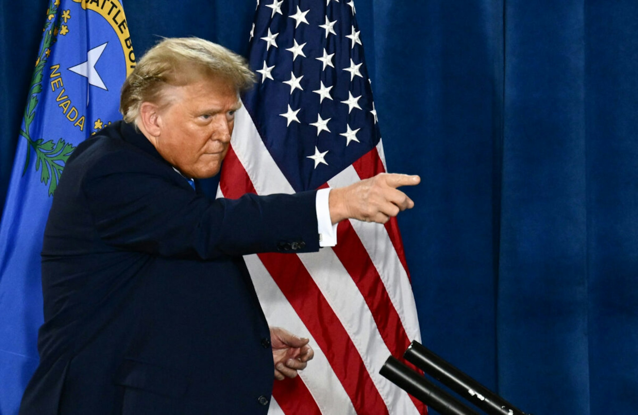 Former US President and 2024 presidential hopeful Donald Trump points after speaking at a Commit to Caucus Rally in Las Vegas, Nevada, on January 27, 2024.