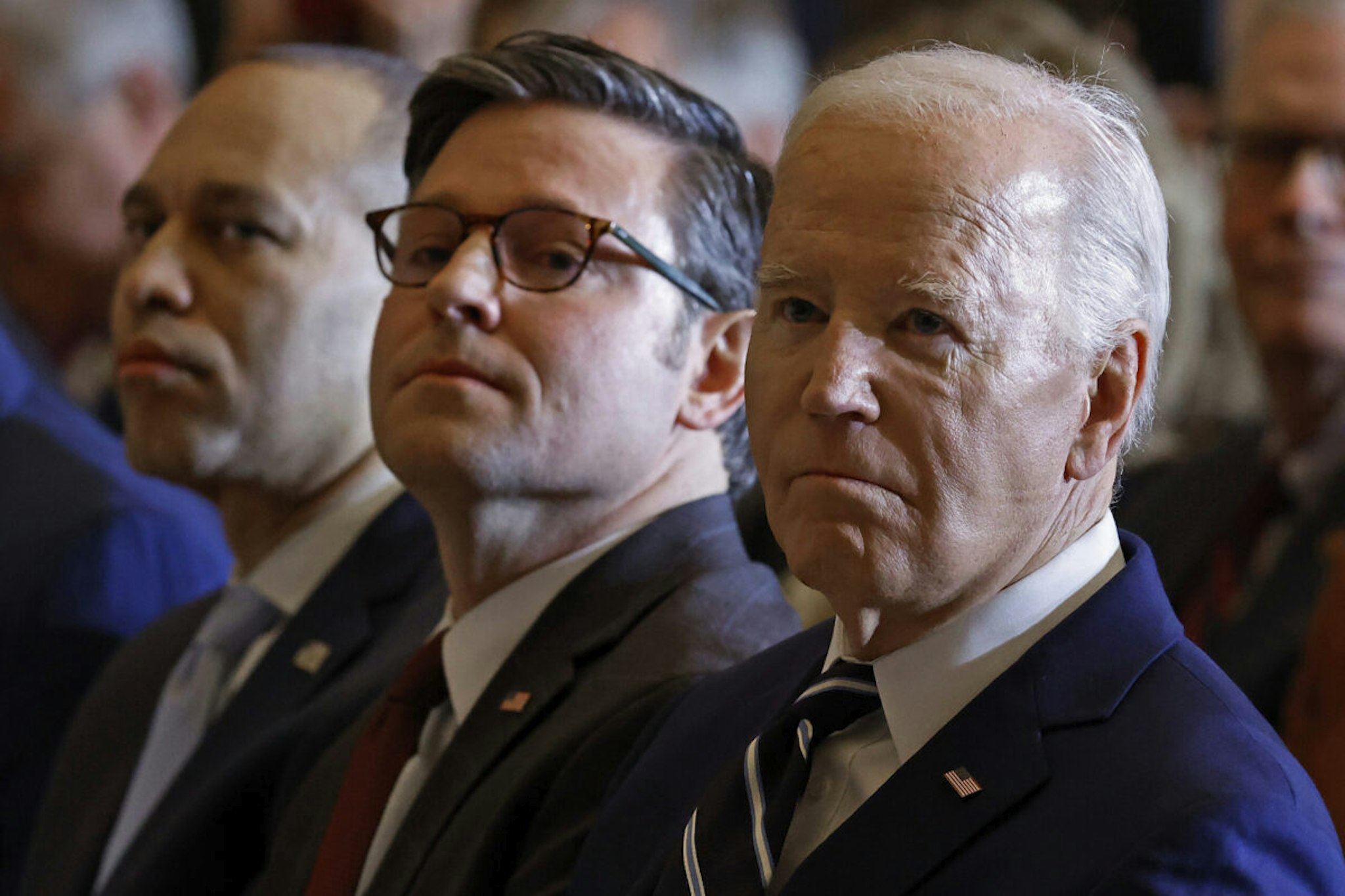 U.S. President Joe Biden, Speaker of the House Mike Johnson (R-LA) and House Minority Leader Hakeem Jeffries (D-NY) listen as Andrea Bocelli performs "Amazing Grace" during the annual National Prayer Breakfast in Statuary Hall in the U.S. Capitol on February 01, 2024 in Washington, DC.