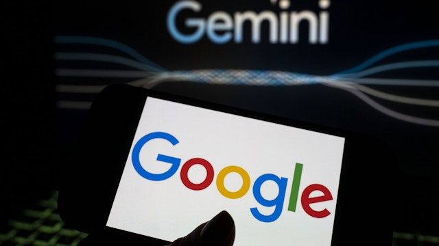 In this photo illustration the logo of 'Google' is displayed on a tablet screen in front of a 'Google Gemini' logo in Ankara, Turkiye on February 10, 2024.