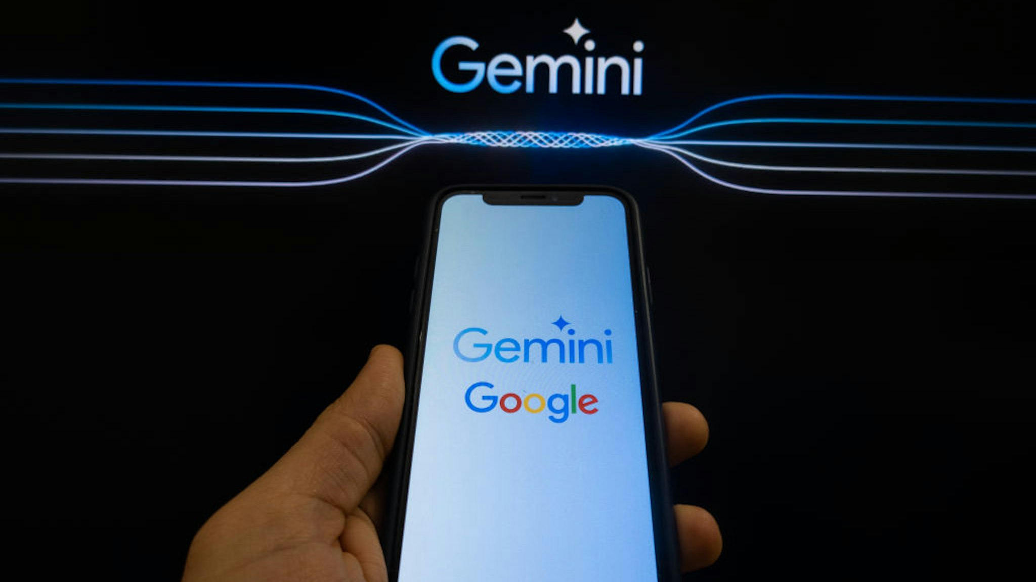 In this photo illustration two different versions of Gemini logo and a Google logo are displayed on a pc screen and a smartphone in L'Aquila, Italy, on February 12th, 2024. Google replaced its AI chatbot "Google Bard" with Gemini. (Photo by Lorenzo Di Cola/NurPhoto via Getty Images)