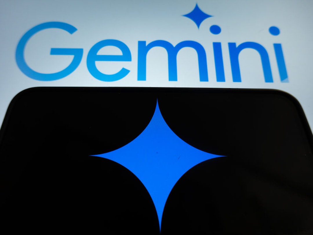 In this photo illustration Gemini logo and an AI icon are displayed on two screens in L'Aquila, Italy, on February 12th, 2024. Google replaced its AI chatbot "Google Bard" with Gemini. (Photo by Lorenzo Di Cola/NurPhoto via Getty Images)