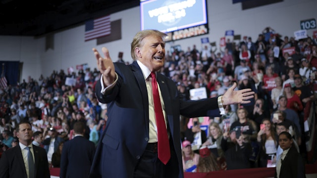 Republican presidential candidate and former President Donald Trump gestures to members of the audience as he leaves a Get Out The Vote rally at Coastal Carolina University on February 10, 2024 in Conway, South Carolina.