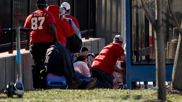 People take cover after a shooting broke out following the Kansas City Chiefs Super Bowl LVIII victory parade on Wednesday, Feb. 14, 2024, in Kansas City, Missouri. (Nick Wagner/The Kansas City Star/Tribune News Service via Getty Images)