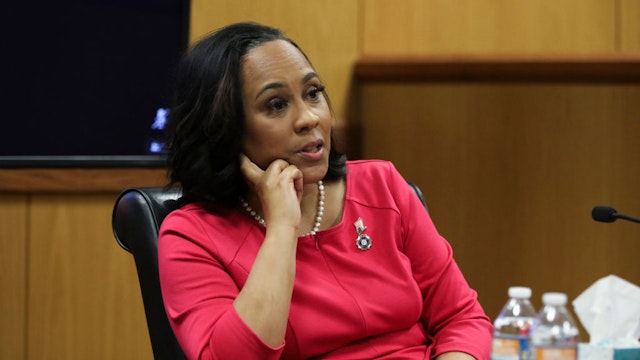 ATLANTA, GA - FEBRUARY 15: Fulton County District Attorney Fani Willis testifies during a hearing in the case of the State of Georgia v. Donald John Trump at the Fulton County Courthouse on February 15, 2024 in Atlanta, Georgia. Judge Scott McAfee is hearing testimony as to whether Willis and Special Prosecutor Nathan Wade should be disqualified from the case for allegedly lying about a personal relationship. (Photo by Alyssa Pointer-Pool/Getty Images)