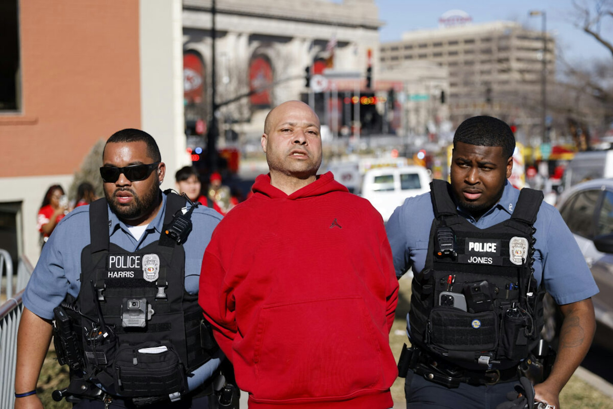 KANSAS CITY, MISSOURI - FEBRUARY 14: A man is detained by law enforcement following a shooting at Union Station during the Kansas City Chiefs Super Bowl LVIII victory parade on February 14, 2024 in Kansas City, Missouri. Several people were shot and two people were detained after a rally celebrating the Chiefs Super Bowl victory.