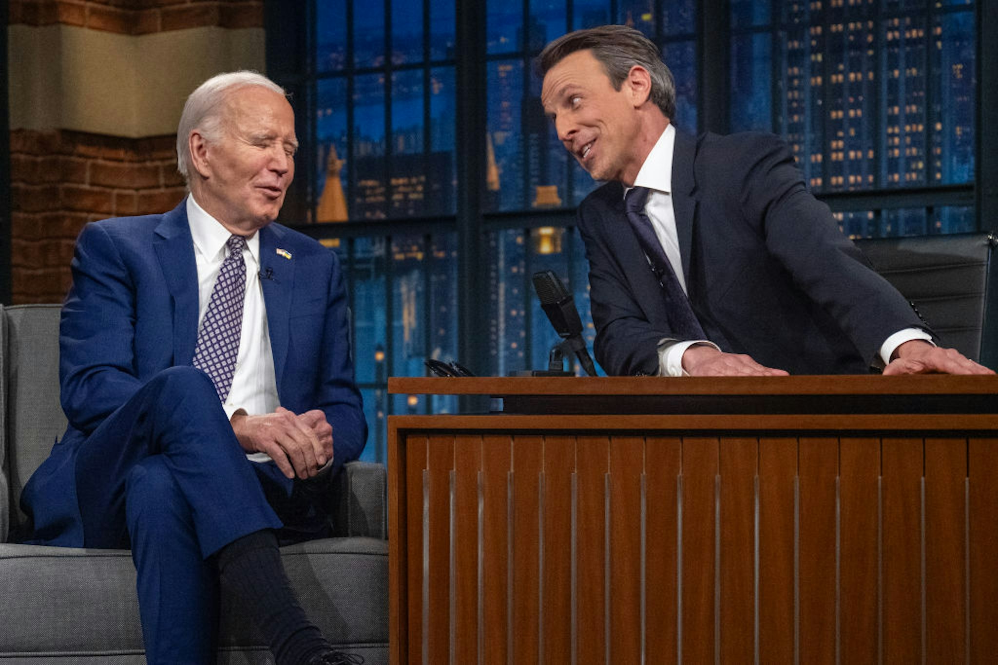 TOPSHOT - (L-R) US President Joe Biden speaks with host Seth Meyers during a taping of "Late Night with Seth Meyers" in New York City on February 26, 2024. (Photo by Jim WATSON / AFP) (Photo by JIM WATSON/AFP via Getty Images)