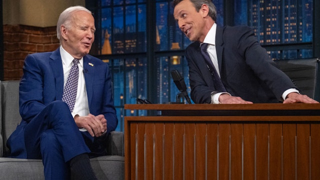 TOPSHOT - (L-R) US President Joe Biden speaks with host Seth Meyers during a taping of "Late Night with Seth Meyers" in New York City on February 26, 2024. (Photo by Jim WATSON / AFP) (Photo by JIM WATSON/AFP via Getty Images)