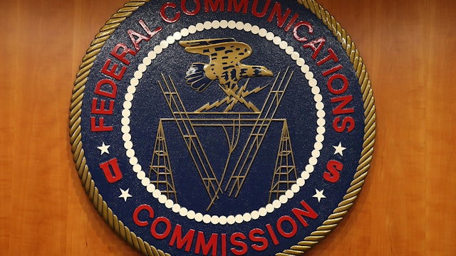 WASHINGTON, DC - FEBRUARY 26: The seal of the Federal Communications Commission hangs inside the hearing room at the FCC headquarters February 26, 2015 in Washington, DC. The Commission will vote on Internet rules, grounded in multiple sources of the Commissions legal authority, to ensure that Americans reap the benefits of an open Internet.