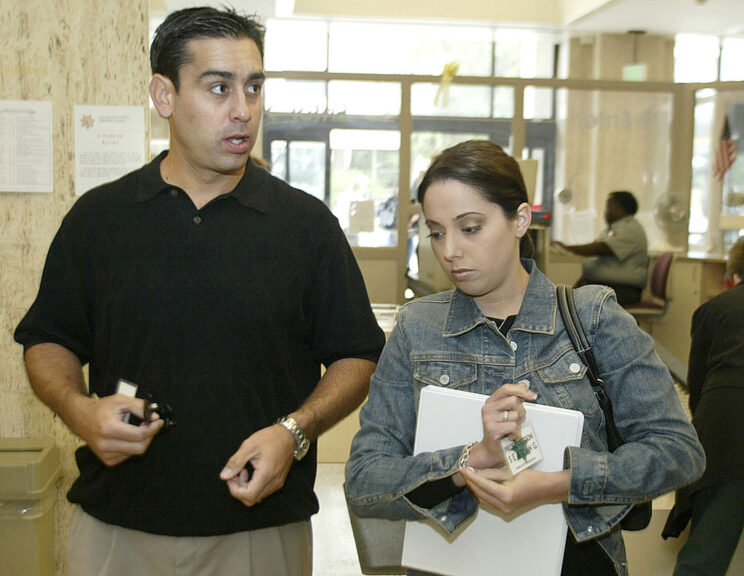 REDWOOD CITY, CA - JUNE 3: Brent Rocha (L), brother of Laci Peterson, and Amy Rocha, sister of Laci Peterson, arrive for the San Mateo County Courthouse for the third day in the Scott Peterson murder trial June 3, 2004 in Redwood City, California. Peterson is charged with the deaths of his wife, Laci, and their unborn child. (Photo by Tony Avelar-Pool/Getty Images)
