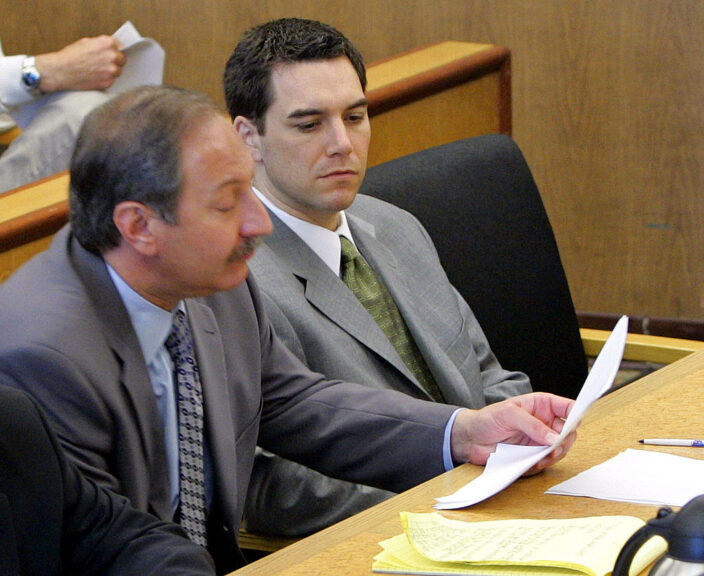 REDWOOD CITY, CA - DECEMBER 9: Scott Peterson (R) sits in the courtroom at the San Mateo Superior Courthouse with his attorney Mark Geragos (L) during defense closing arguments in the penalty phase of Peterson's trial December 9, 2004 in Redwood City, California. Peterson was found guilty of first degree murder of his wife, Laci, and second degree murder of their unborn son and could receive the death penalty. (Photo by Fred Larson-Pool/Getty Images)