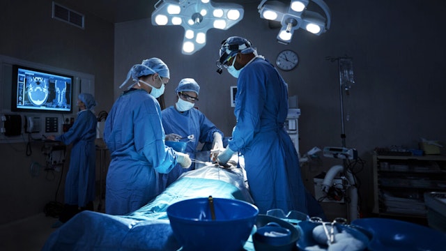 Shot of a team of surgeons performing a surgery in an operating room