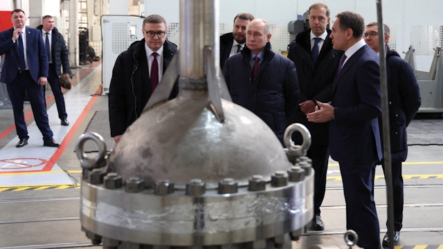 In this pool photograph distributed by Russian state agency Sputnik, Russia's President Vladimir Putin visits the Chelyabinsk Forge-and-Press Plant in Chelyabinsk on February 16, 2024.