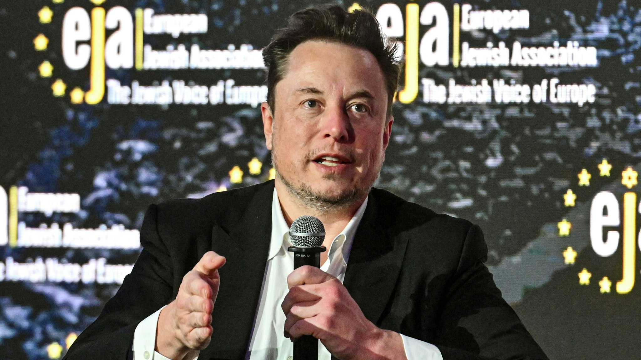 KRAKOW, POLAND - JANUARY 22: SpaceX, X (formerly known as Twitter), and Tesla CEO Elon Musk speaks during live interview with Ben Shapiro at the symposium on fighting antisemitism on January 22, 2024 in Krakow, Poland. The symposium on anti-semitism, organized by the European Jewish Association, was held ahead of international Holocaust remembrance day on January 27.