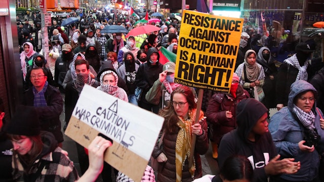 Pro-Palestinian demonstrators gather for the "Flood Manhattan for Gaza" rally outside Radio City Music Hall where US President Joe Biden is attending a fundraiser for his re-election campaign, in New York, March 28, 2024.