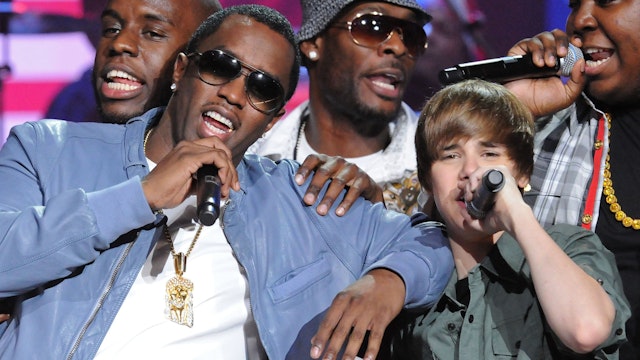 Sean "Diddy" Combs, Justin Bieber, Sean Kingston and Chris Brown perform at the BET-SOS Saving Ourselves  Help for Haiti Benefit Concert at AmericanAirlines Arena on February 5, 2010 in Miami, Florida.