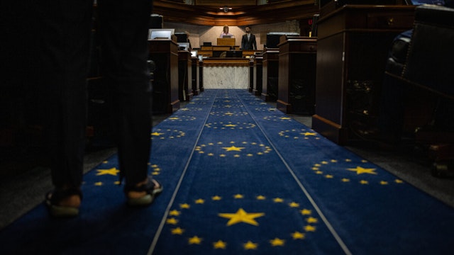 A person stands on carpet matching the Indiana State Flag within the Senate chamber at the Indiana State Capitol building on July 25, 2022 in Indianapolis, Indiana.