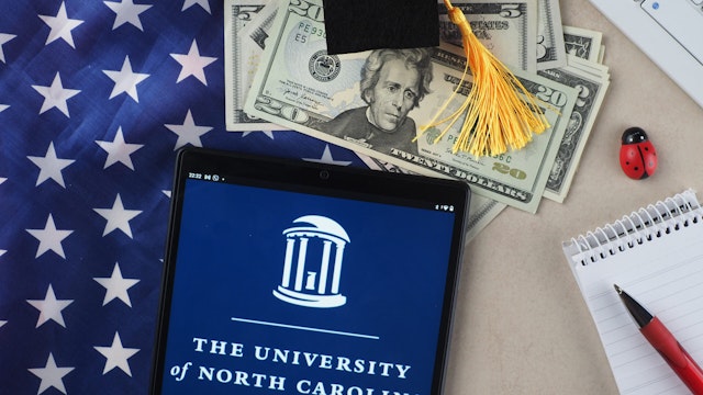 In this photo illustration, the University of North Carolina, Chapel Hill logo seen displayed on a tablet.