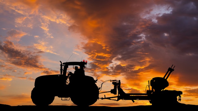 Tractor plowing a field at sunset. Preparing the field for sowing. Anton Petrus. Getty Images.