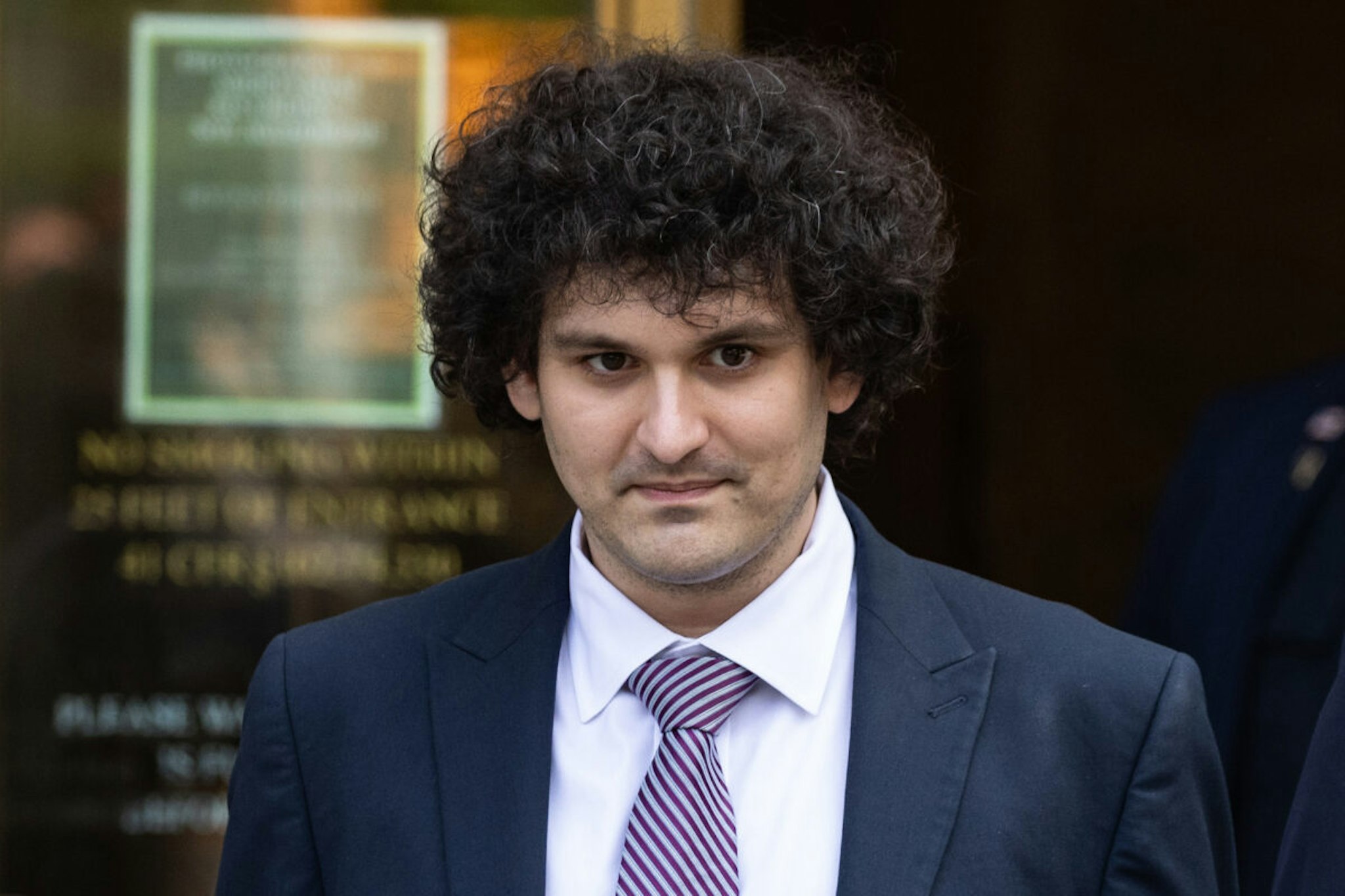 Sam Bankman-Fried, co-founder of FTX Cryptocurrency Derivatives Exchange, leaves court in New York, US, on Wednesday, July 26, 2023. Bankman-Fried faces a total of 13 counts ranging from conspiracy to commit wire fraud to conspiracy to violate the anti-bribery provisions of the Foreign Corrupt Practices Act, and faces more than 155 years in prison if convicted of all of them - although any sentence is likely to be much lower if he is found guilty.