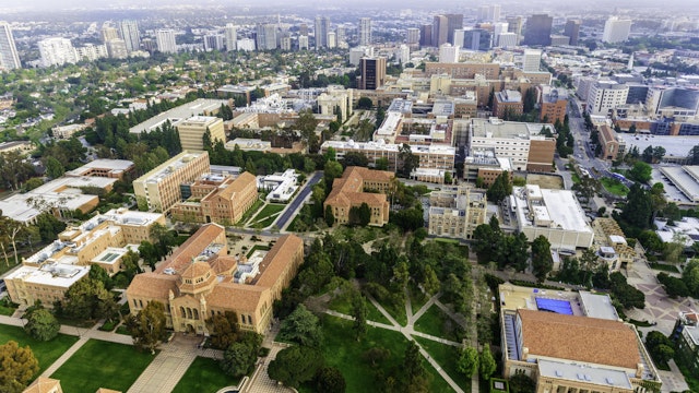dszc. Getty Images. aerial view of campus of University of California in Los Angeles, with smoggy cityscape of Los Angeles, California in the background.