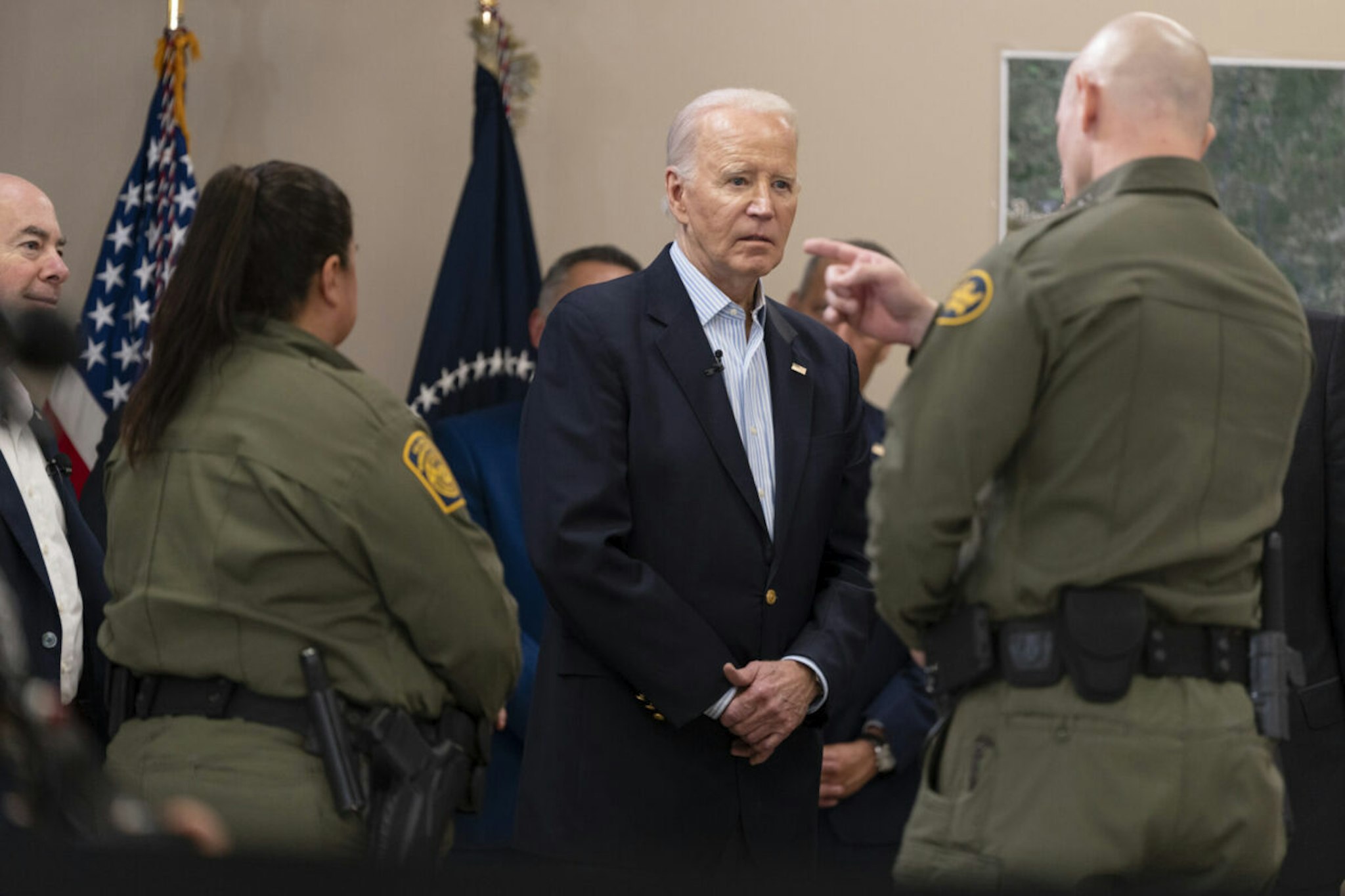 President Joe Biden listens to a U.S. Customs and Border Protection officer during a presentation about immigration and border security at the Brownsville Station on February 29, 2024 in Olmito, Texas.