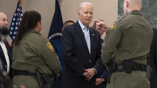 President Joe Biden listens to a U.S. Customs and Border Protection officer during a presentation about immigration and border security at the Brownsville Station on February 29, 2024 in Olmito, Texas.