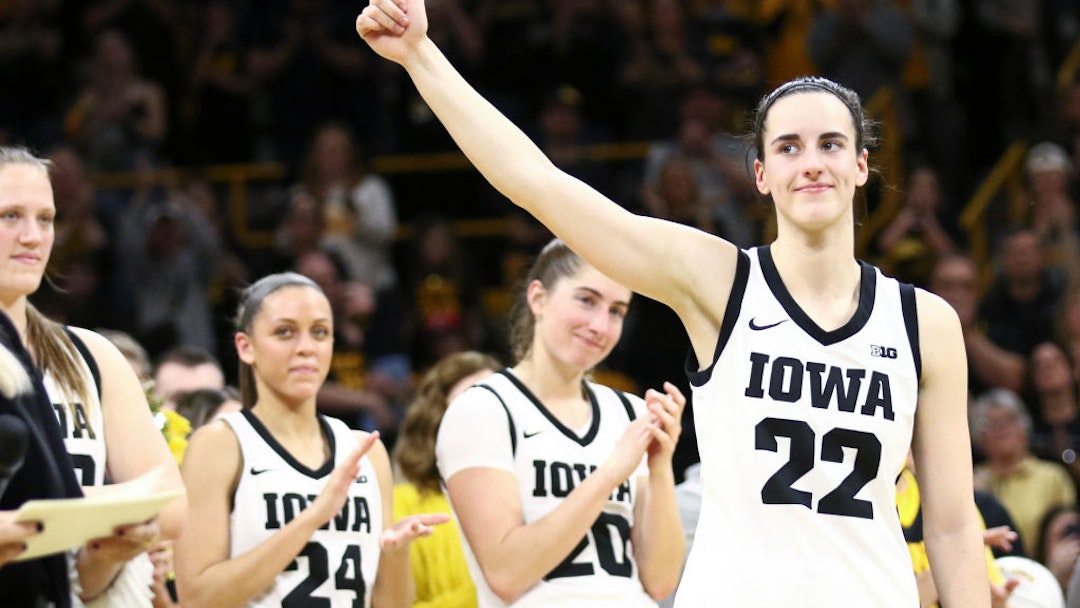 IOWA CITY, IOWA- MARCH 3: Guard Caitlin Clark #22 of the Iowa Hawkeyes waves to the crowd during senior day festivities after the match-up against the Ohio State Buckeyes at Carver-Hawkeye Arena on March 3, 2024 in Iowa City, Iowa. (Photo by Matthew Holst/Getty Images)