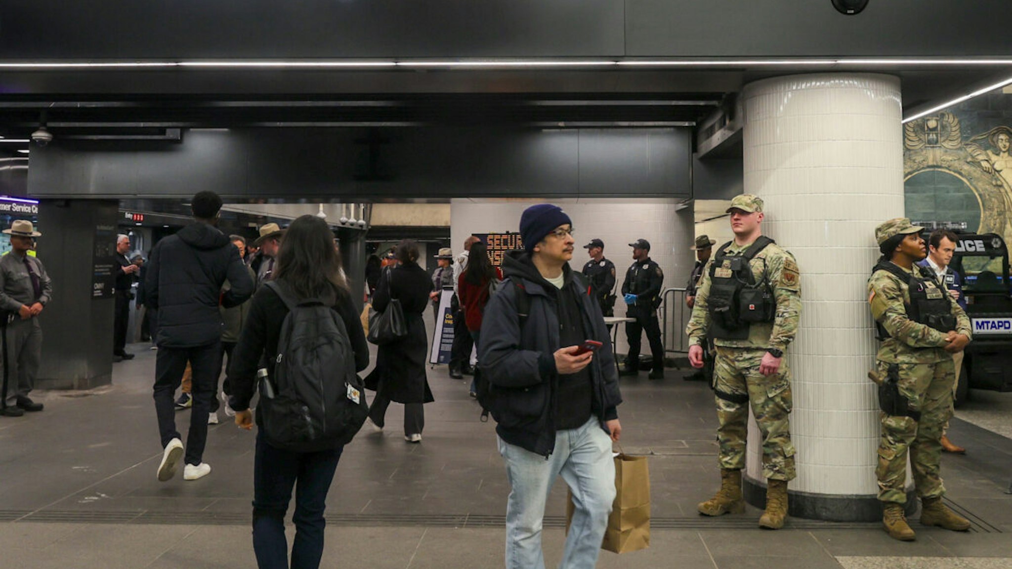 NEW YORK, US - MARCH 7: Security forces, including National Guard troops and police, take security measures at a subway station in New York, United States on March 07, 2024. US National Guard deployed 750 National Guard troops and additional 250 state troopers to combat rising crime in NYC subways, Governor Kathy Hochul announced in a press conference on Wednesday.