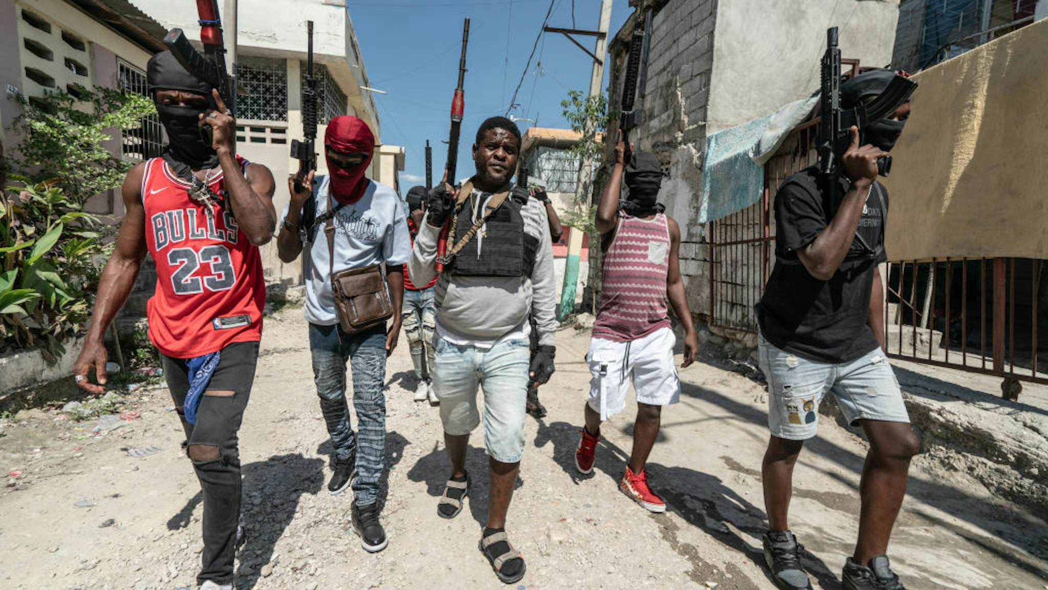 PORT-AU-PRINCE, HAITI - FEBRUARY 22: Gang Leader Jimmy 'Barbecue' Cherizier patrolling the streets with G-9 federation gang members in the Delmas 3 area on February 22, 2024, in Port-au-Prince, Haiti. There has a been fresh wave of violence in Port-au-Prince where, according to UN estimates, gangs control 80% of the city. (Photo by Giles Clarke/Getty Images)