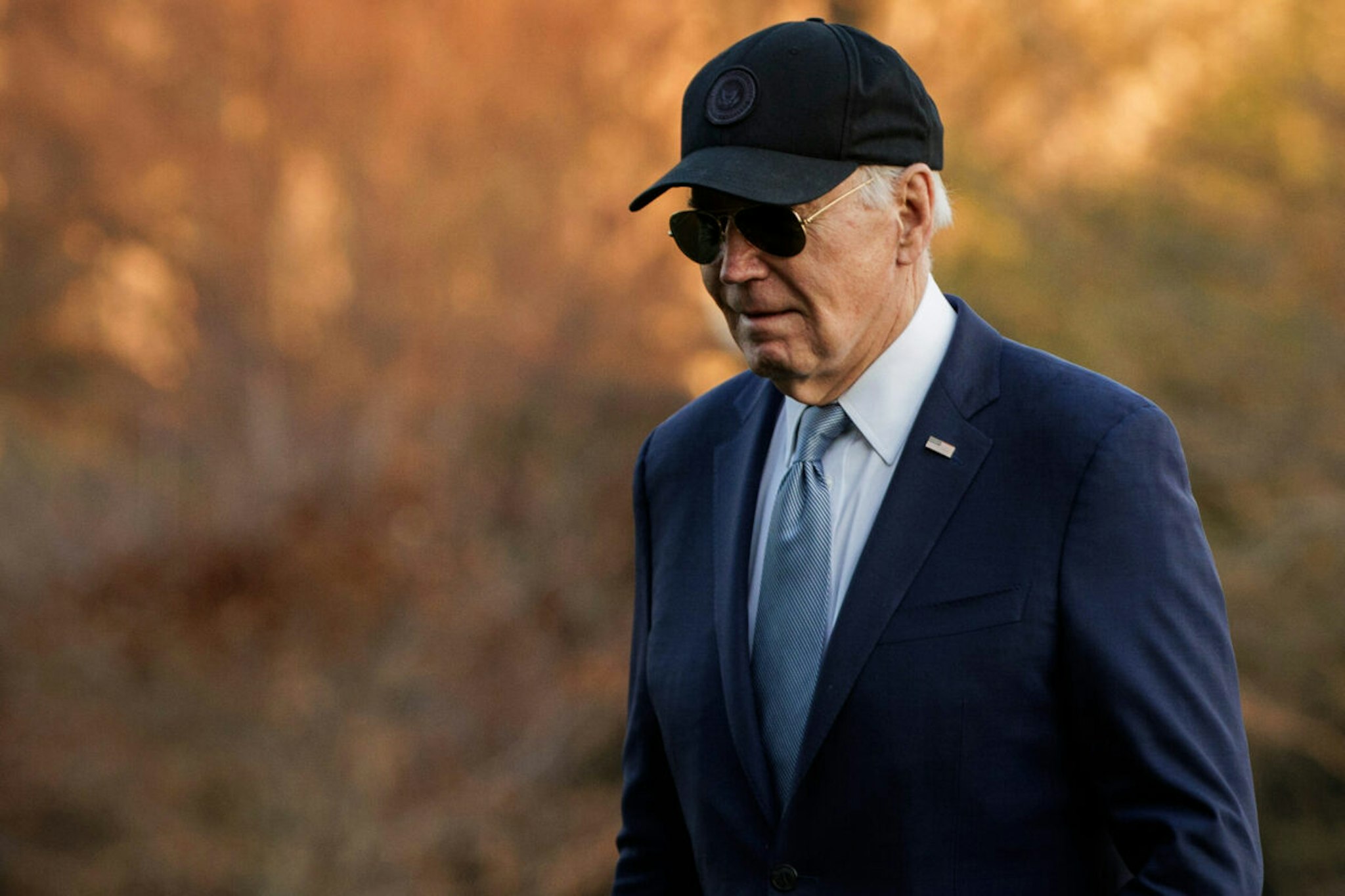 US President Joe Biden walks on the South Lawn of the White House after arriving on Marine One in Washington, DC, US, on Thursday, March 21, 2024. A lawsuit filed against President Joe Biden and the US Department of Energy in Louisiana federal court on Thursday asks a judge to overturn the temporary pause of new licenses to export natural gas via ocean-going tankers.