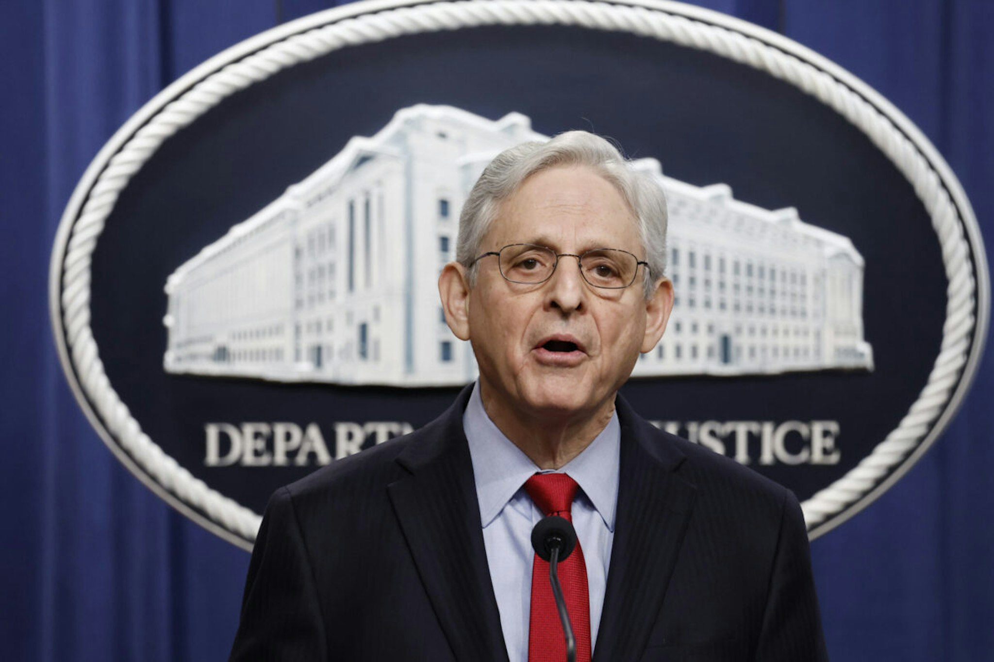 WASHINGTON, DC - MARCH 21: U.S. Attorney General Merrick Garland speaks during a news conference at the Department of Justice Building on March 21, 2024 in Washington, DC. During the news conference Garland and DOJ officials announced the department would be taking action against Apple, claiming that the tech company has an illegal monopoly on smartphones, violating antitrust laws.
