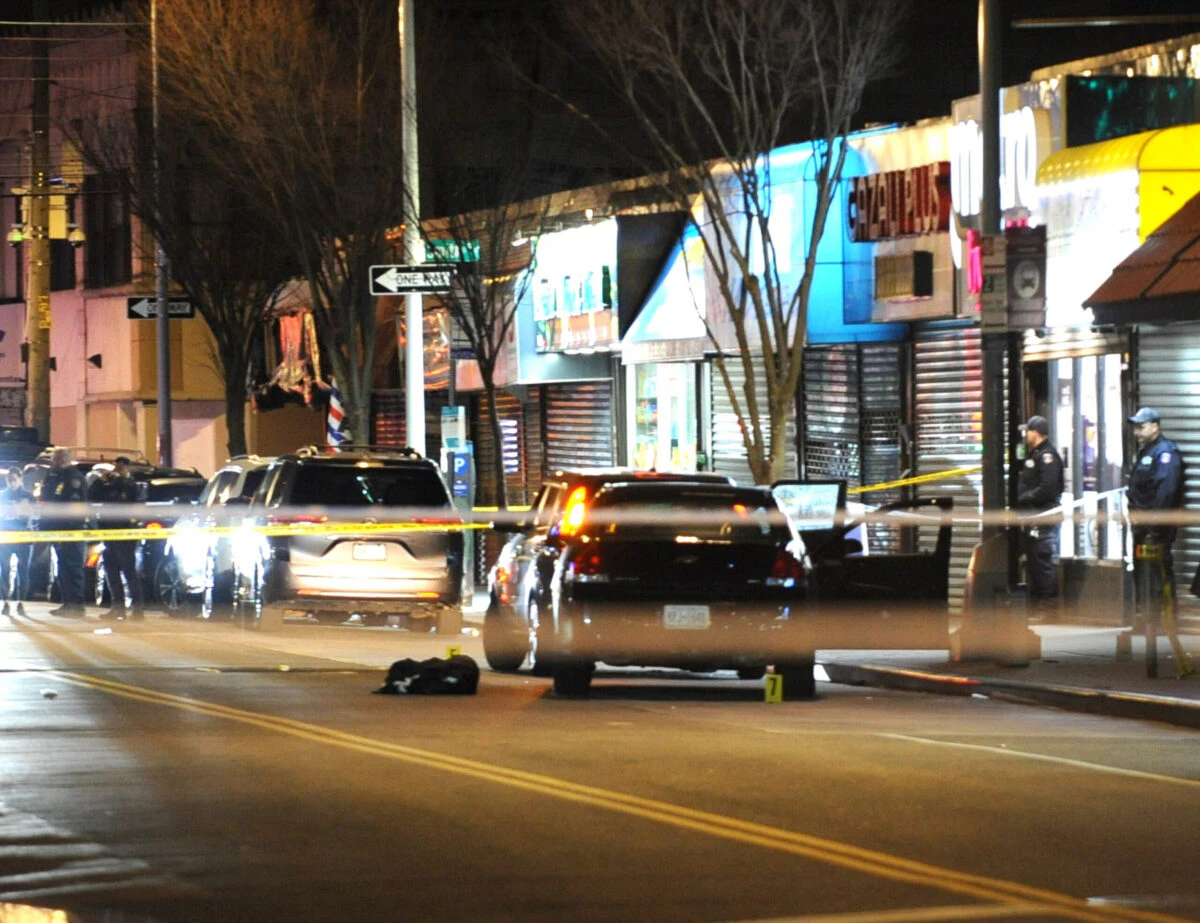 Police secure the vehicle in front of 1919 Mott Ave., Far Rockaway, from which a New York Police Department officer was shot while making a car stop on Monday, March 25, 2024, in New York City.