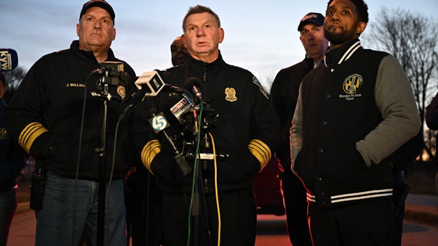 Baltimore Police Commissioner Richard Worley, with Mayor Brandon Scott (R) and Fire Department Chief James Wallace (L), speaks at a press conference on the collapse of the Francis Scott Key Bridge Baltimore, Maryland, on March 26, 2024.