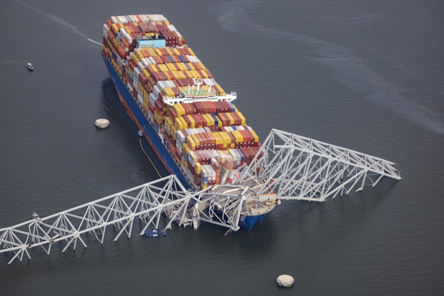 BALTIMORE, MARYLAND - MARCH 26: In an aerial view, cargo ship Dali is seen after running into and collapsing the Francis Scott Key Bridge on March 26, 2024 in Baltimore, Maryland. Rescuers are searching for at least seven people, authorities say, while two others have been pulled from the Patapsco River.
