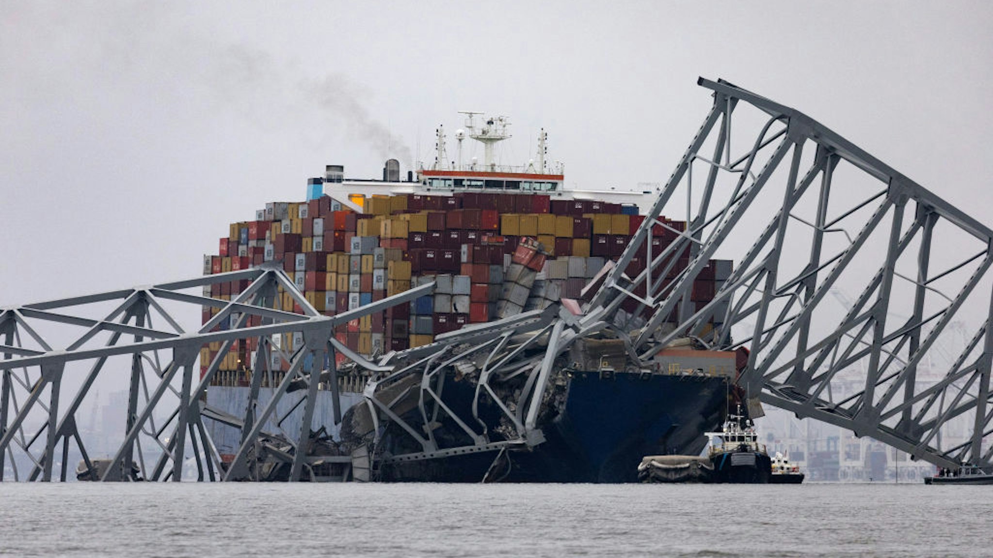 BALTIMORE, MARYLAND - MARCH 27: Workers continue to investigate and search for victims after the cargo ship Dali collided with the Francis Scott Key Bridge causing it to collapse yesterday, on March 27, 2024 in Baltimore, Maryland. Two survivors were pulled from the Patapsco River and six missing people are presumed dead after the Coast Guard called off rescue efforts. A work crew was fixing potholes on the bridge, which is used by roughly 30,000 people each day, when the ship struck at around 1:30am on Tuesday morning. The accident has temporarily closed the Port of Baltimore, one of the largest and busiest on the East Coast of the U.S. (Photo by Scott Olson/Getty Images)