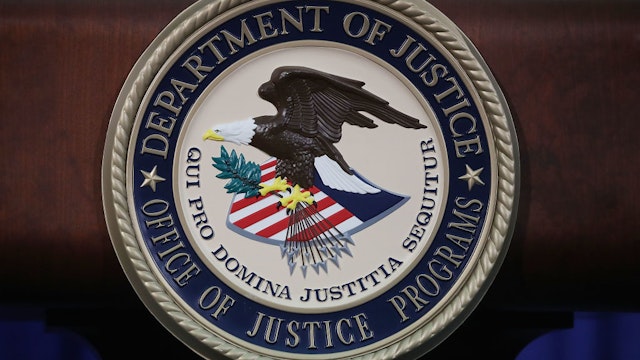 WASHINGTON, DC - JUNE 29: The Justice Department seal is seen on the lectern during a Hate Crimes Subcommittee summit on June 29, 2017 in Washington, DC. The meeting gave stakeholders the opportunity to offer imput to the committee before it makes its recommendations to the attorney general on what the Department of Justice can do to improve reporting, investigation and prosecution of hate crimes.