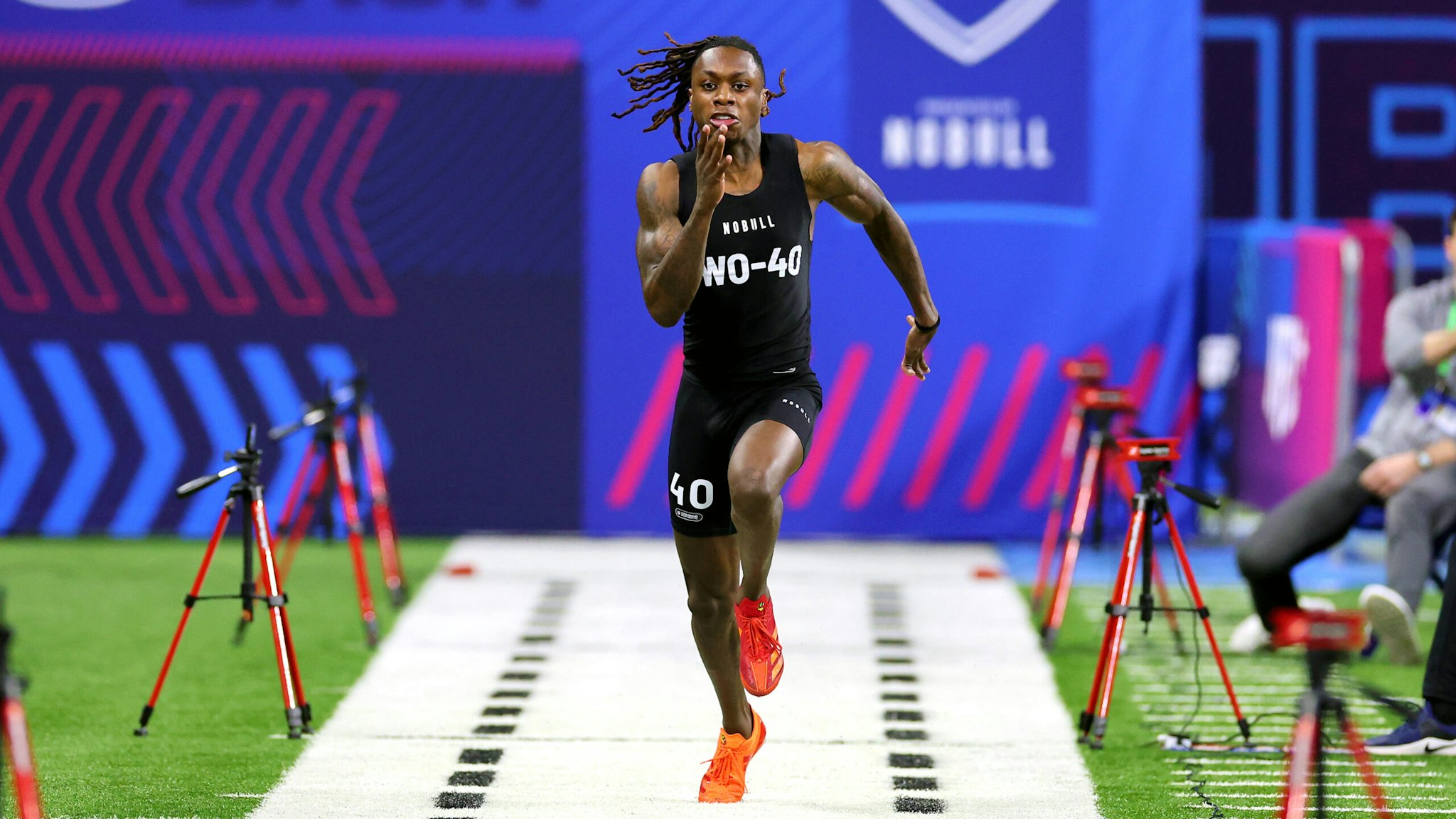 INDIANAPOLIS, INDIANA - MARCH 02: Xavier Worthy #WO40 of Texas participates in the 40-yard dash during the NFL Combine at Lucas Oil Stadium on March 02, 2024 in Indianapolis, Indiana.