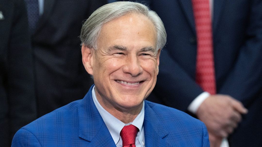 Texas Governor Greg Abbott smiles during a press conference to make an announcement on the future of the space industry in Texas, at NASA's Johnson Space Center in Houston, Texas, on March 26, 2024. Abbott on March 26 announced the board of directors for the newly-created Texas Space Commission.