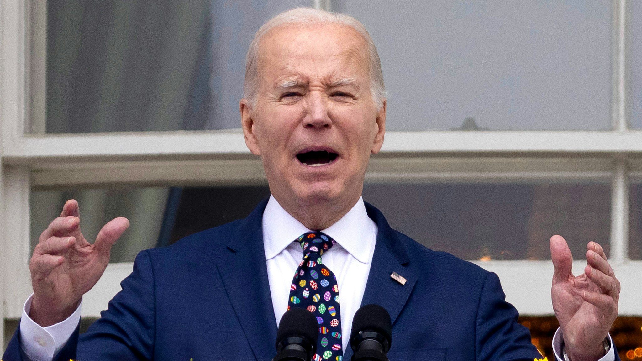 US President Joe Biden speaks on the Truman Balcony of the White House during the Easter Egg Roll on the South Lawn in Washington, DC, US, on Monday, April 1, 2024. The First Lady, a teacher for more than 30 years, created this year's theme of "EGGucation."