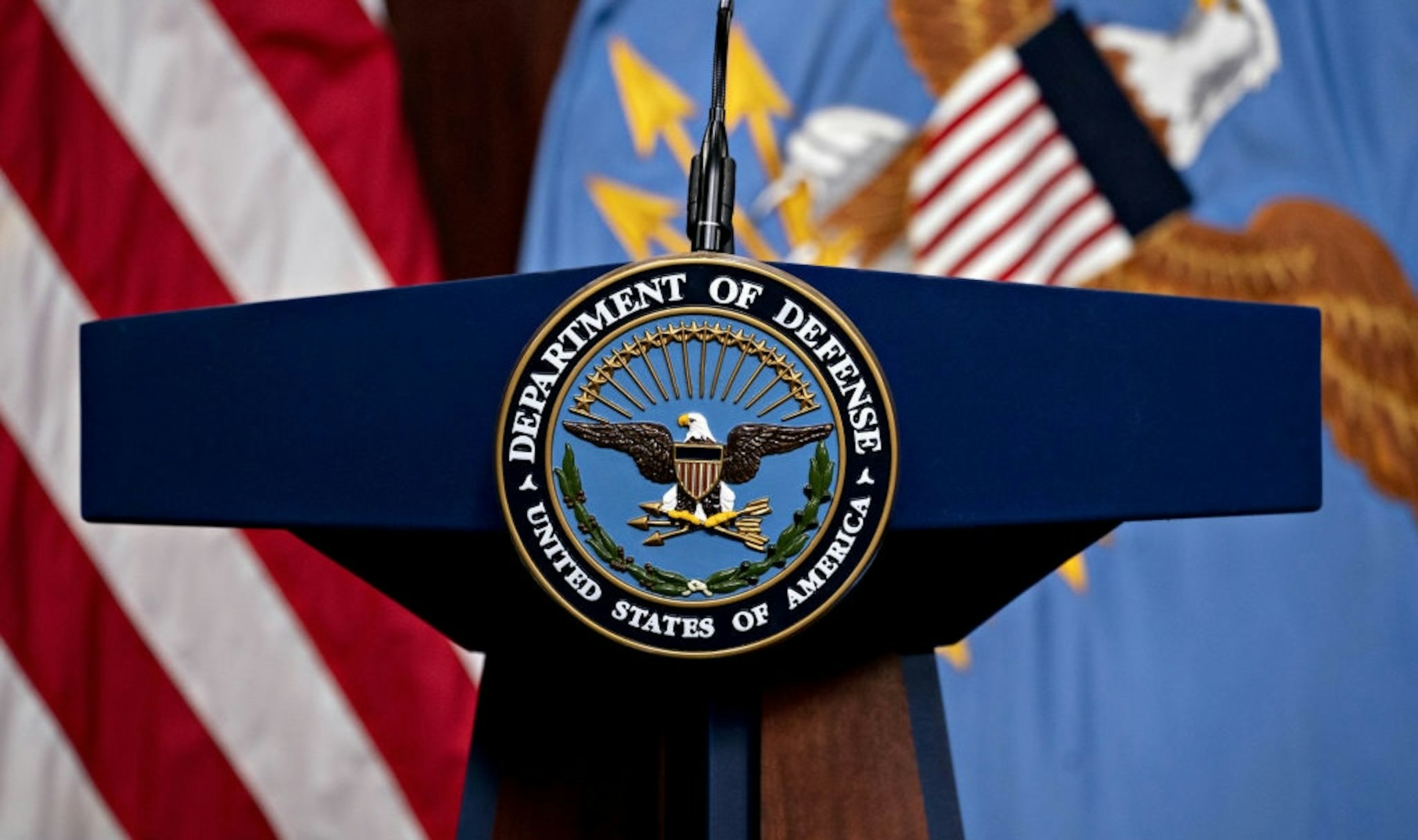 The U.S. Department of Defense (DOD) seal in the Pentagon Briefing Room in Arlington, Virginia., U.S., on Wednesday, Sept. 1, 2021. President Biden yesterday declared an end to two decades of U.S. military operations in Afghanistan, offering an impassioned defense of his withdrawal and rejecting criticism that it was mishandled. Photographer: Andrew Harrer/Bloomberg