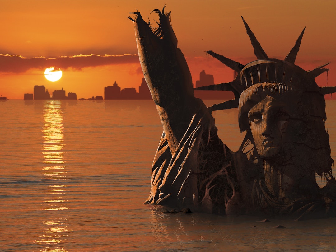 Global warming, conceptual computer illustration. Statue of Liberty, New York, USA, flooded and in ruins, in a possible future. This is showing a rise in sea levels due to global warming. Global warming is the increase of average temperature of the Earth's atmosphere and oceans. The melting of ice and glaciers contribute to the rise in sea levels. MARK GARLICK/SCIENCE PHOTO LIBRARY. Getty Images.