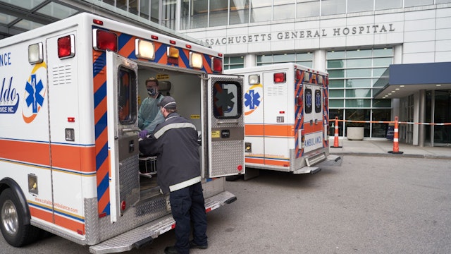 CHELSEA, UNITED STATES - APRIL 23: A Cataldo EMS team transports a suspected Covid-19 patient from Chelsea to Massachusetts General Hospital on April 23, 2020 in Boston, Massachusetts United States. EMTs and Paramedics for Cataldo Ambulance work during the surge of Covid-19 cases transporting suspected Covid-19 patients and other patients. (Photo by David Degner/Getty Images).