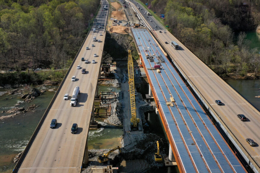 FREDERICKSBURG, VA - APRIL 6: In an aerial view, vehicles on Interstate 95 travel past a construction project to add three lanes to the I-95 Rappahannock River Crossing on April 6, 2021 in Fredericksburg, Virginia. The site of the work is a vital chokepoint for cars and freight trucks moving both north and south along the East Coast. At the end of March, President Joe Biden introduced a $2 trillion plan to overhaul and upgrade the nation's infrastructure. The plan aims to revitalize the U.S. transportation infrastructure, water systems, broadband internet, make investments in manufacturing and job training efforts, and other goals. (Photo by Drew Angerer/Getty Images)